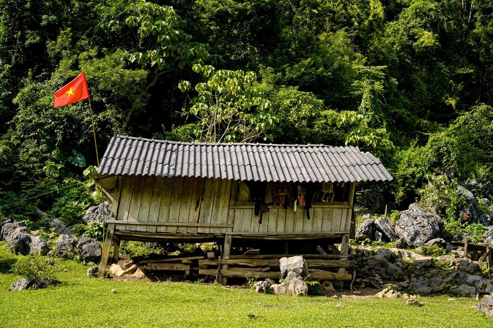 Every house hangs a national flag