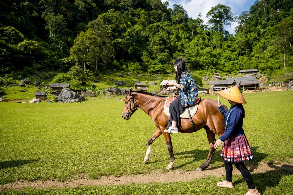 Ms. Say teaches visitors how to ride horses